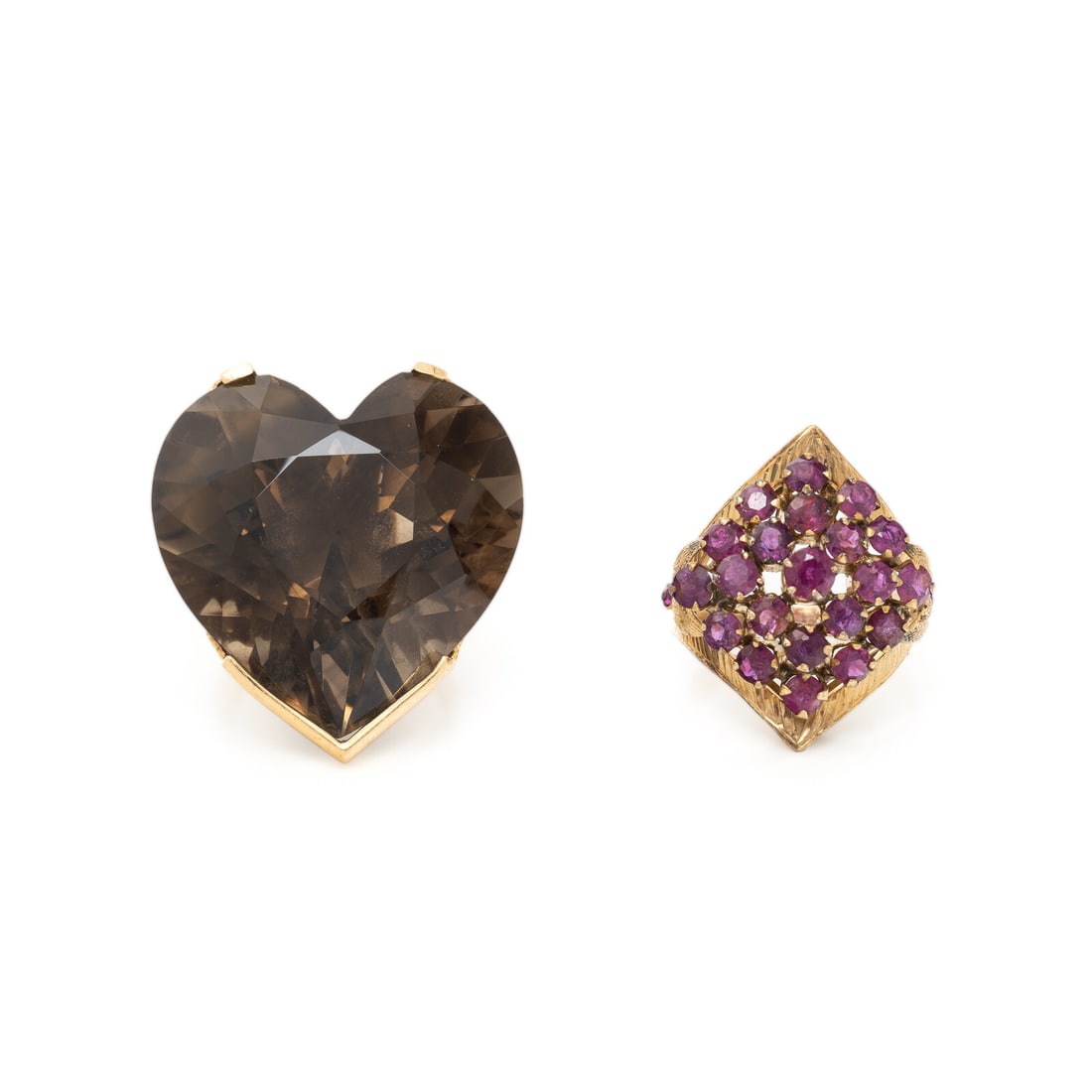 TWO YELLOW GOLD AND GEMSTONE RINGS: TWO YELLOW GOLD AND GEMSTONE RINGS Including two rings, one set with a heart shape smoky quartz measuring approximately 29.75 x 28.50 x 18.50 mm and the other set with round rubies. Yellow gold and
