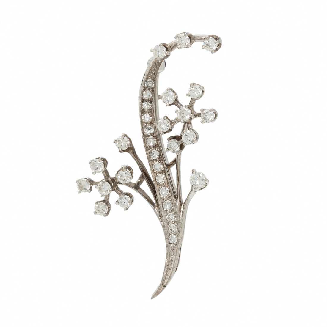 DIAMOND BROOCH: DIAMOND BROOCH Round and single cut diamonds weighing approximately 0.70 - 0.75 carat total. White gold. 1 5/8 x 1 inches. Gross weight: 2.55 dwt. Property of a Private Collector This lot is located i