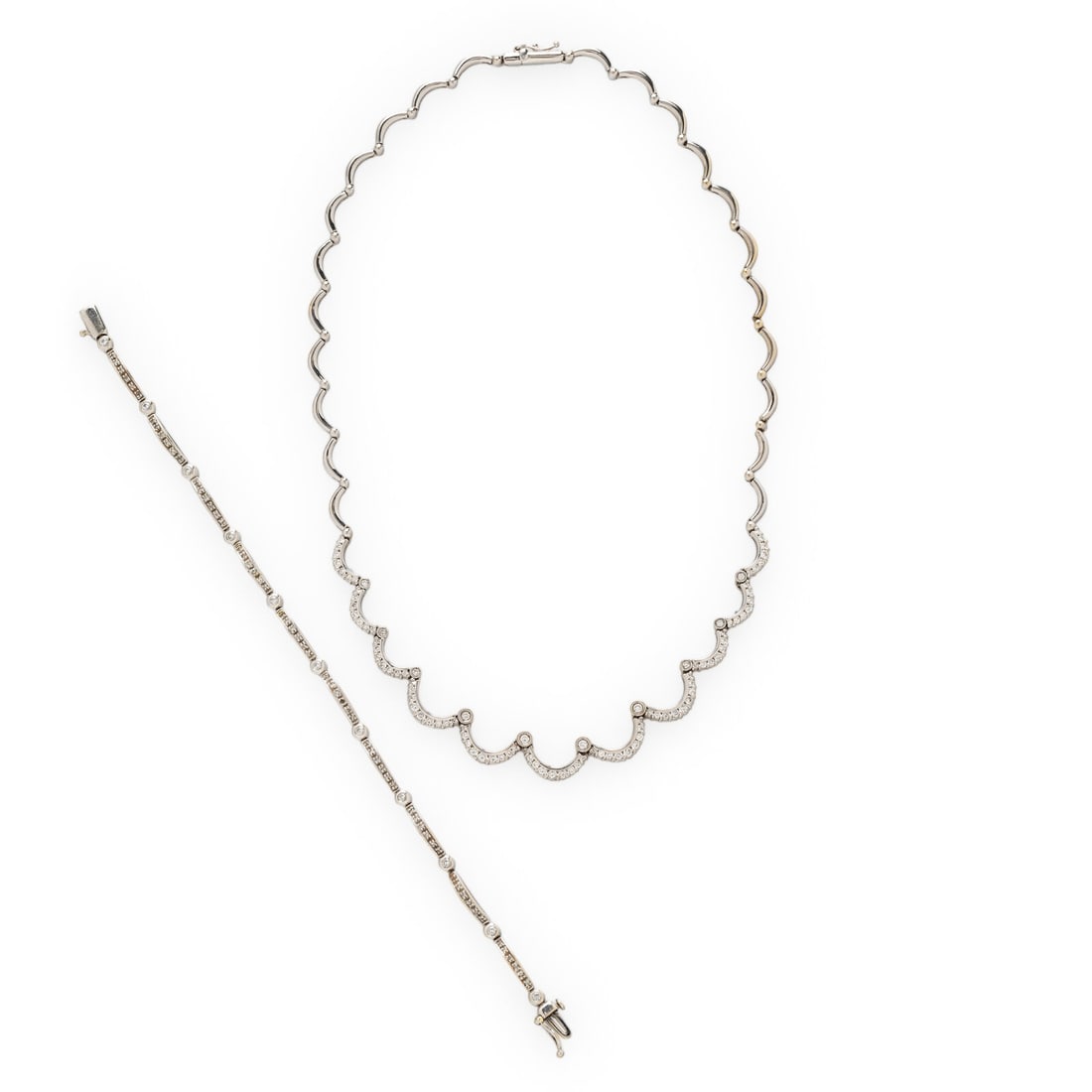 DIAMOND AND WHITE GOLD NECKLACE AND BRACELET: DIAMOND AND WHITE GOLD NECKLACE AND BRACELET Including a necklace and a bracelet set with round diamonds weighing approximately 2.80 - 3.00 carats combined total. 18 and 14 karat white gold. Necklace: