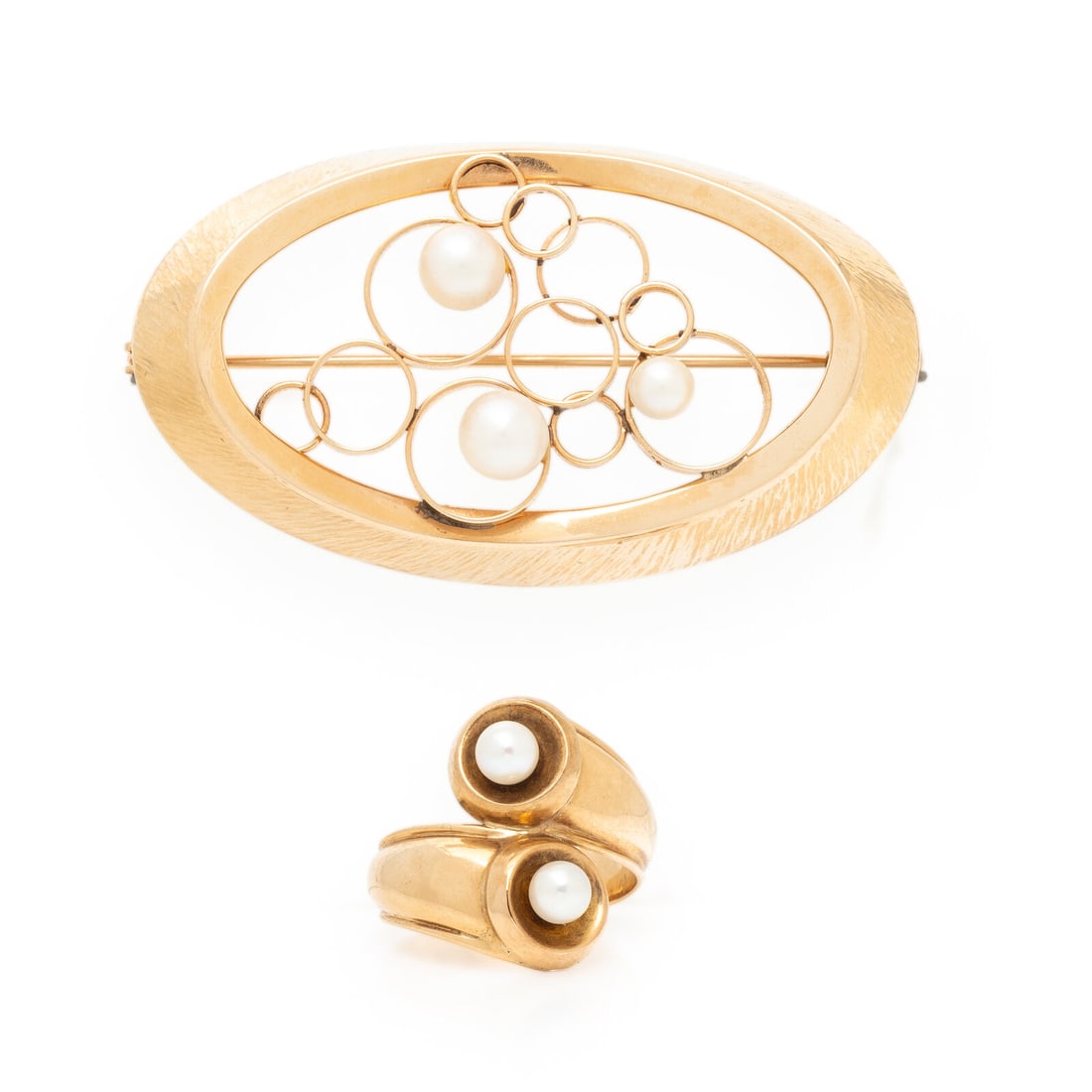 FINNISH, YELLOW GOLD AND CULTURED PEARL RING AND BROOCH: FINNISH, YELLOW GOLD AND CULTURED PEARL RING AND BROOCH Including a ring and a brooch set with cultured pearls measuring approximately 4.40 - 6.00 mm. 14 karat yellow gold. Ring size 6 3/4. Brooch: 2