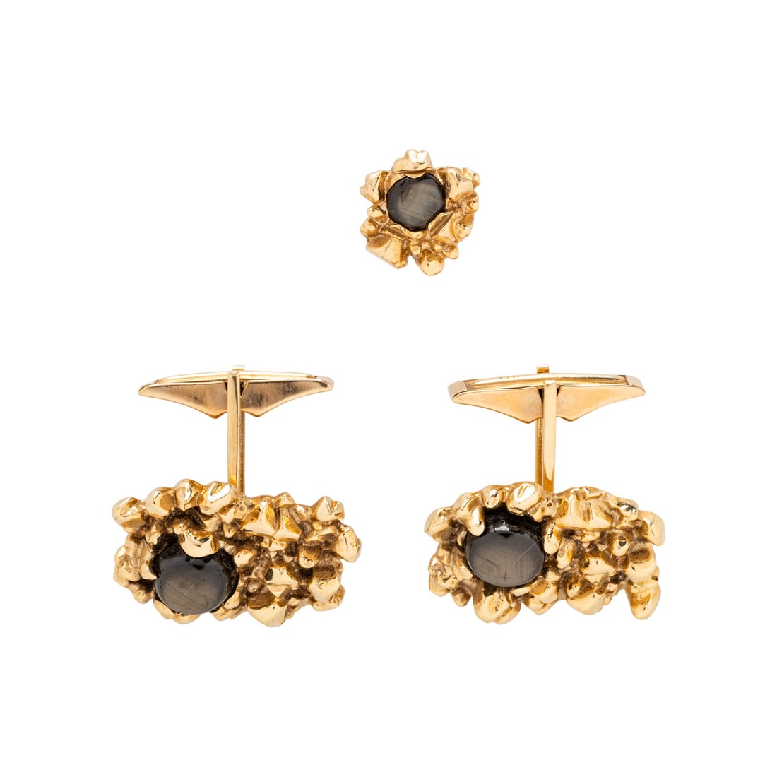 YELLOW GOLD AND BLACK STAR SAPPHIRE CUFFLINKS AND TIE PIN: YELLOW GOLD AND BLACK STAR SAPPHIRE CUFFLINKS AND TIE PIN Including a pair of cufflinks and a tie pin set with round cabochon black star sapphires. 14 karat yellow gold. Cufflinks: 7/8 x 1/2 inch.