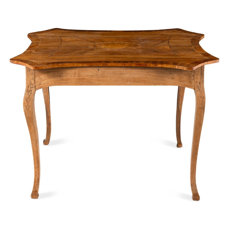 An Italian Walnut and Fruitwood Center Table: An Italian Walnut and Fruitwood Center Table 19th Century Height 29 1/4 x width 42 x depth 33 inches. Property from the Estate of Ben Solomon, Solomon-Paris Antiques, Indianapolis