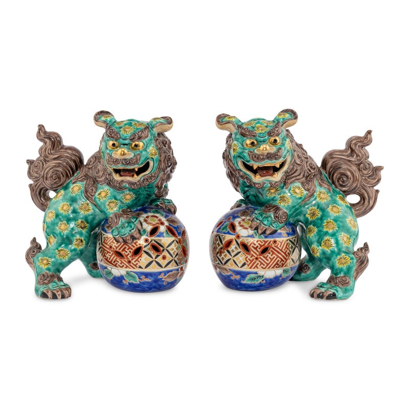 A Pair of Chinese Porcelain Guardian Lions: A Pair of Chinese Porcelain Guardian Lions 20th Century height 12 1/2 x width 12 x depth 8 1/2 inches. Property from the Estate of Ben Solomon, Solomon-Paris Antiques, Indianapolis, Indiana This