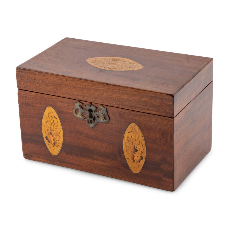 An English Mahogany and Marquetry Tea Caddy: An English Mahogany and Marquetry Tea Caddy Early 19th Century the lid and front of case decorated with oval cartouches with foliate marquetry decoration, the lid opening to a divided interior with tw
