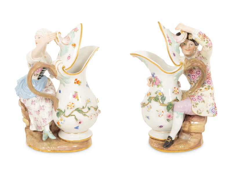 A Pair of Meissen Porcelain Figural Ewers: A Pair of Meissen Porcelain Figural Ewers 19th/20th Century Each marked under foot with underglaze blue crossed swords. Height 7 3/4 inches. This lot is located in Palm