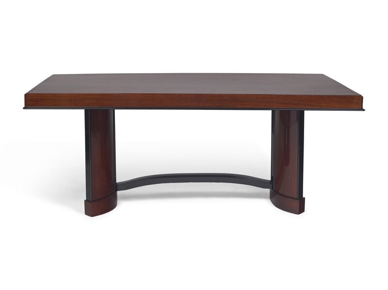 An Art Deco Rosewood and Ebonized Draw-End Dining Table: An Art Deco Rosewood and Ebonized Draw-End Dining Table French, Circa 1930 The table top with ebonized molded at base resting on a curved trestle base. Height 30 3/4 x width 38 x length 72 inches,