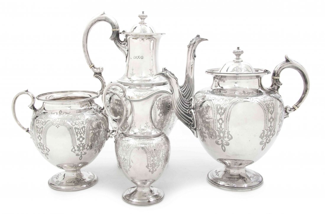 A George III Assembled Silver Tea and Coffee Service, H: A George III Assembled Silver Tea and Coffee Service, Henry John Lias & James Wakely, London, comprising an open sugar, 1873, a coffee pot and a teapot with ivory insulators, and a creamer, 1879, each