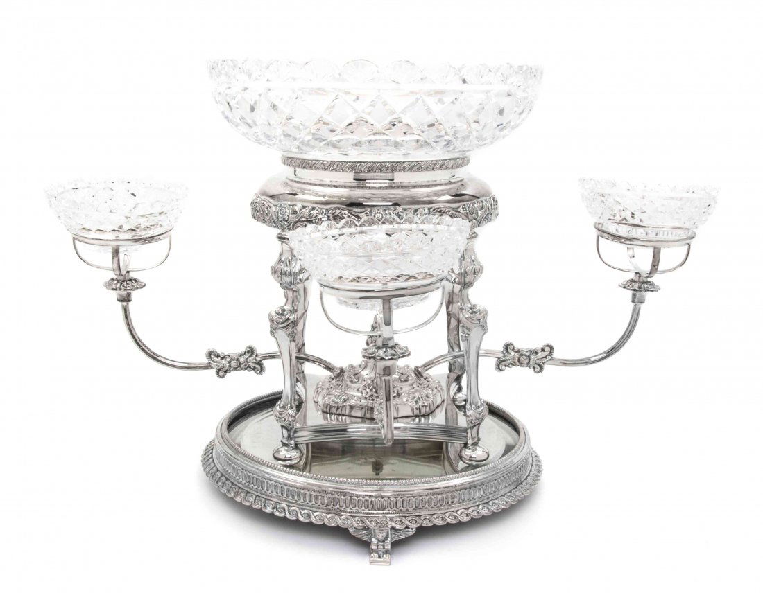 An English Silverplate and Cut Glass Epergne, William A: An English Silverplate and Cut Glass Epergne, William Adams, the circular bowl with diamond and fan cut decoration, raised on a conforming frame, issuing four arms ending in similarly cut smaller bowl