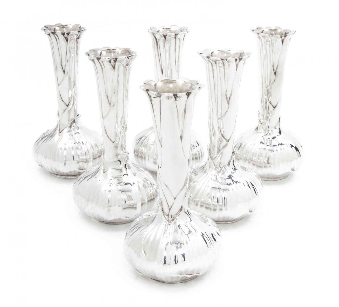 A Set of Seven French Silverplate Bud Vases, Christofle: A Set of Seven French Silverplate Bud Vases, Christofle, of organic form with a tapering neck terminating in a bulbous base. Height 4 3/4 inches. Property from the Estate of David C. Copley, La Jolla,