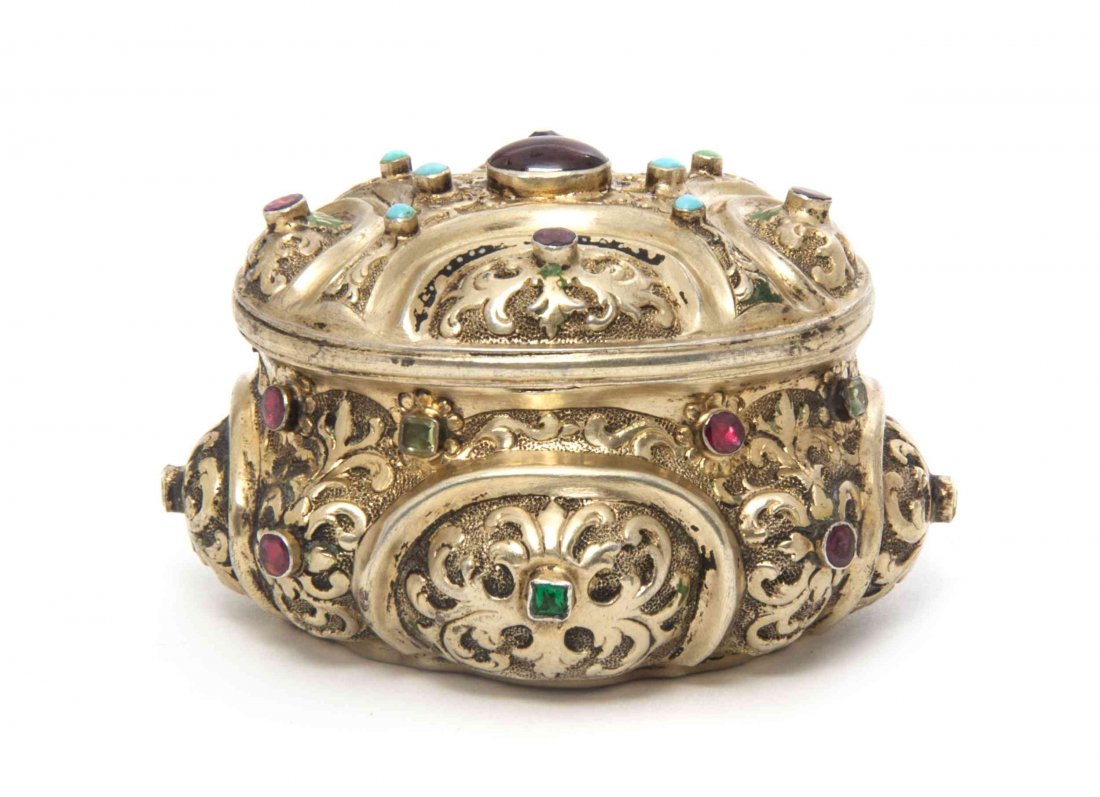 An Austrian or German Gilt Silver and Glass Inset Box, : An Austrian or German Gilt Silver and Glass Inset Box, of oval form with repousse and faux gem decoration throughout. Width 2 7/8 inches.