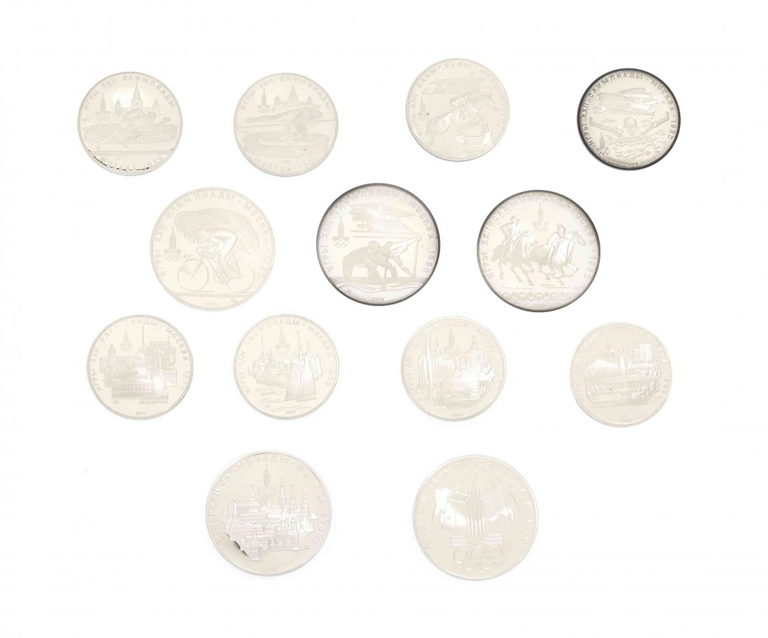 A Set of Twenty-Eight Russian Silver 1980 Olympic Coins: A Set of Twenty-Eight Russian Silver 1980 Olympic Coins, comprising 14 Ten Roubles and 14 Five Roubles, each depicting various scenes of Russia and Olympic sports, together with a 2001 American Silver