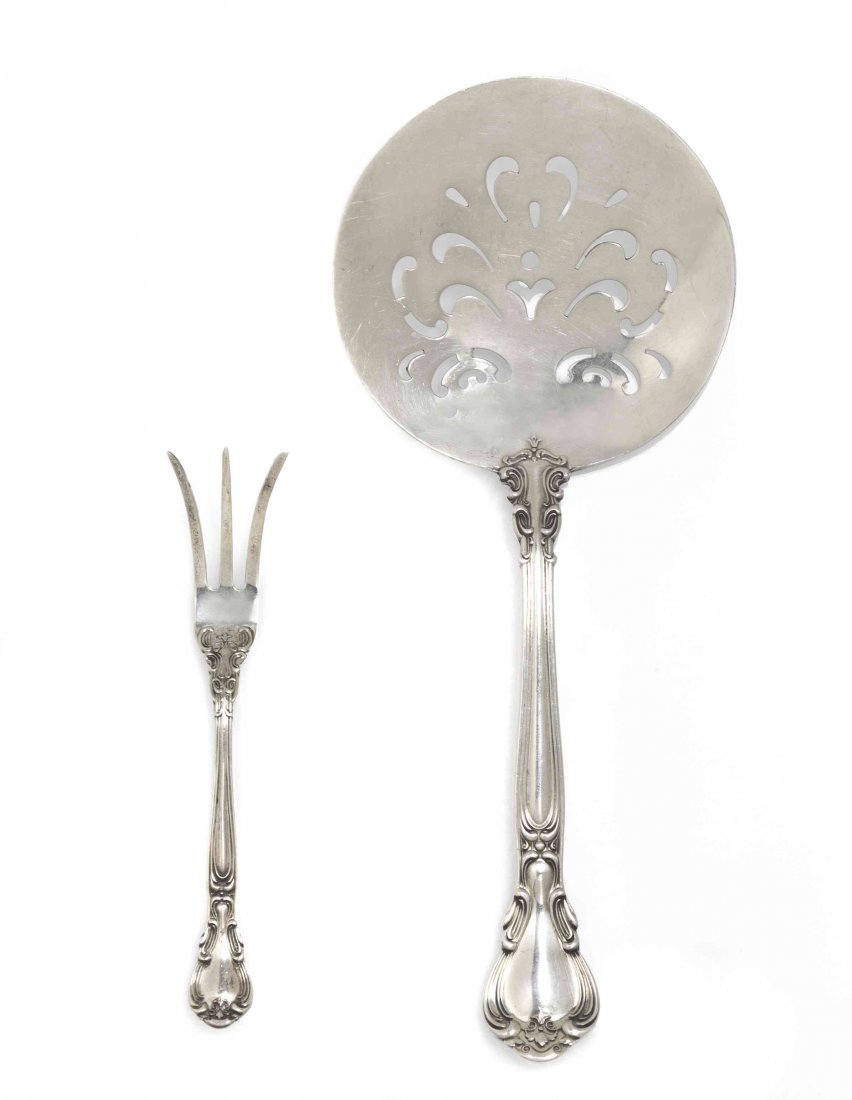 Two American Sterling Silver Serving Articles, Gorham, : Two American Sterling Silver Serving Articles, Gorham, in the Chantilly pattern, comprising a pierced tomato server and a lemon fork; approximate total weight 2.69 ozt. Length of longer 7 3/8 inches.
