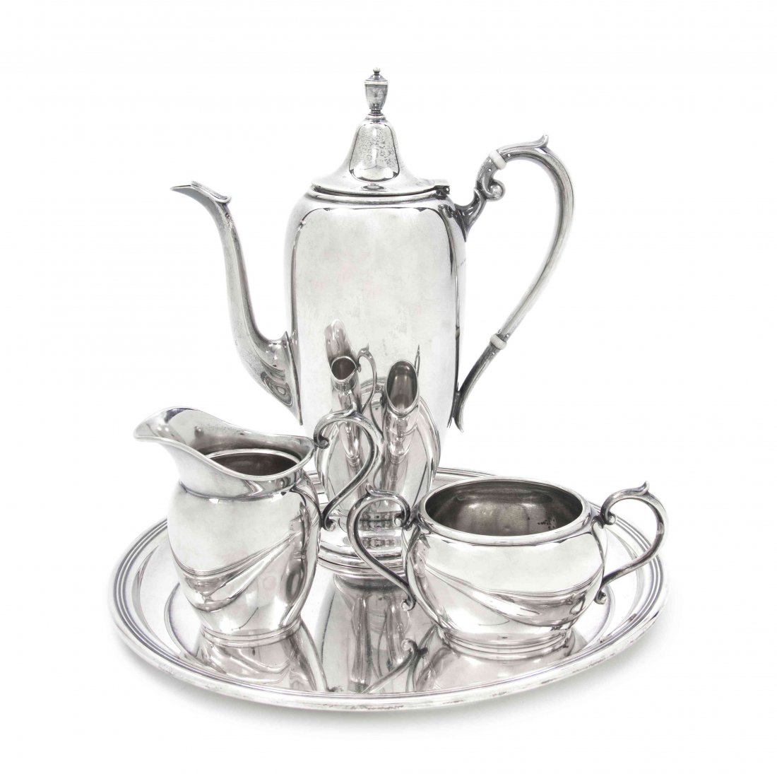 An American Sterling Silver Coffee Service, Gorham, Dia: An American Sterling Silver Coffee Service, Gorham, comprising a coffee pot with ivory insulators, a creamer, an open sugar and a matching round tray; approximate total weight overall 30.625 ozt. Diam