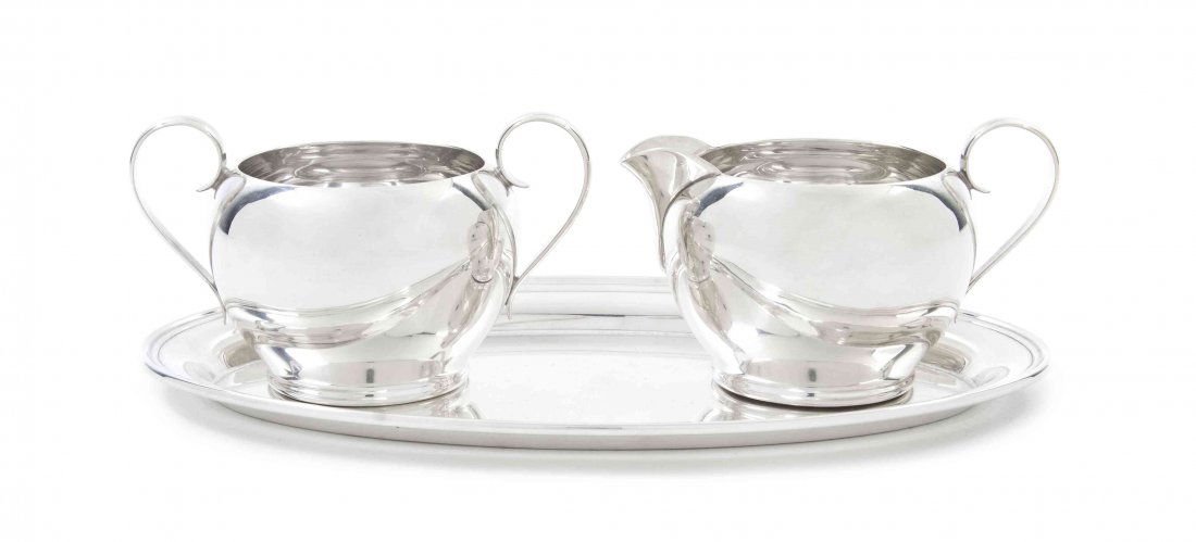 An American Sterling Silver Creamer and Sugar Set, Gorh: An American Sterling Silver Creamer and Sugar Set, Gorham, each of bulbous form with an applied strap handle, with an oval undertray; approximate total weight 11.09 ozt. Width of tray 9 inches.