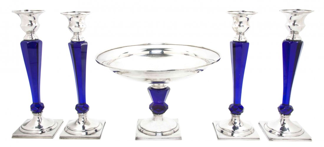 An American Sterling Silver and Cobalt Glass Table Garn: An American Sterling Silver and Cobalt Glass Table Garniture, Hawkes, each with a faceted baluster standard raised on a square foot, comprising a compote with a circular bowl and four candlesticks wit