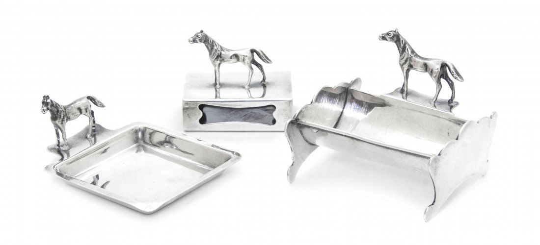 A Set of American Sterling Silver Equestrian Smoking Ar: A Set of American Sterling Silver Equestrian Smoking Articles, Herbst & Wassall, comprising a cigarette holder, an ash receiver and a match safe, each mounted with a standing horse; approximate total