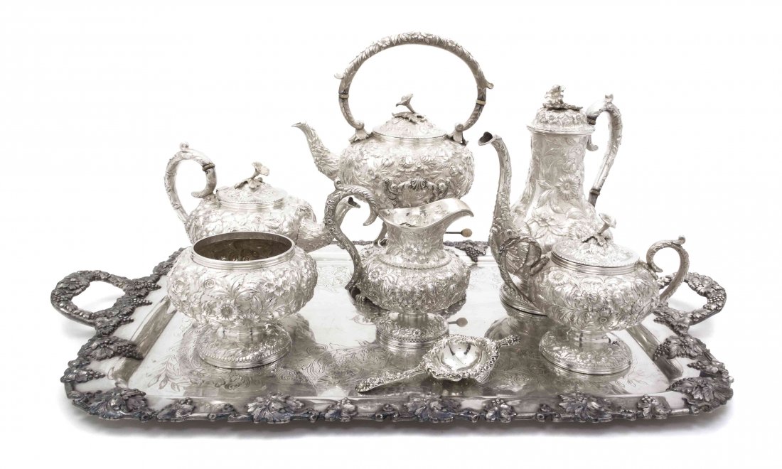 An American Sterling Silver Tea and Coffee Service, S. : An American Sterling Silver Tea and Coffee Service, S. Kirk & Son, comprising a teapot, coffee pot and a kettle on stand with ivory insulators, a creamer, covered sugar, waste bowl and a tea strainer,