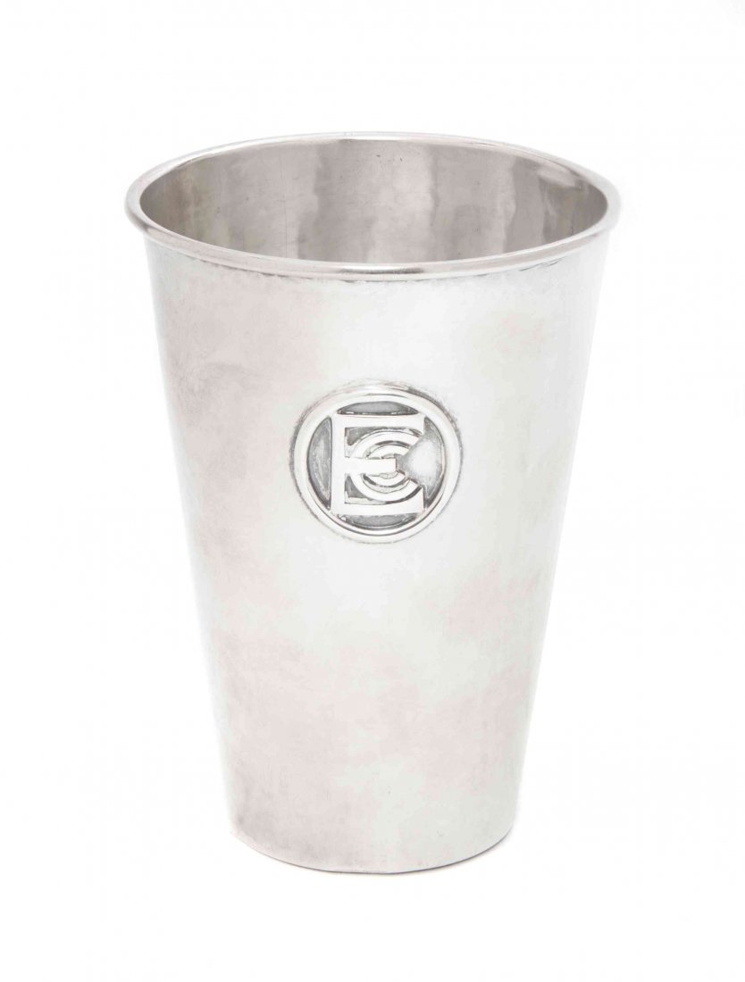 An American Arts & Crafts Sterling Silver Tumbler, Chic: An American Arts & Crafts Sterling Silver Tumbler, Chicago Silver Company, of tapering cylindrical form, with an applied monogram ECC; approximate weight 6.08 ozt. Height 4 5/8 inches.