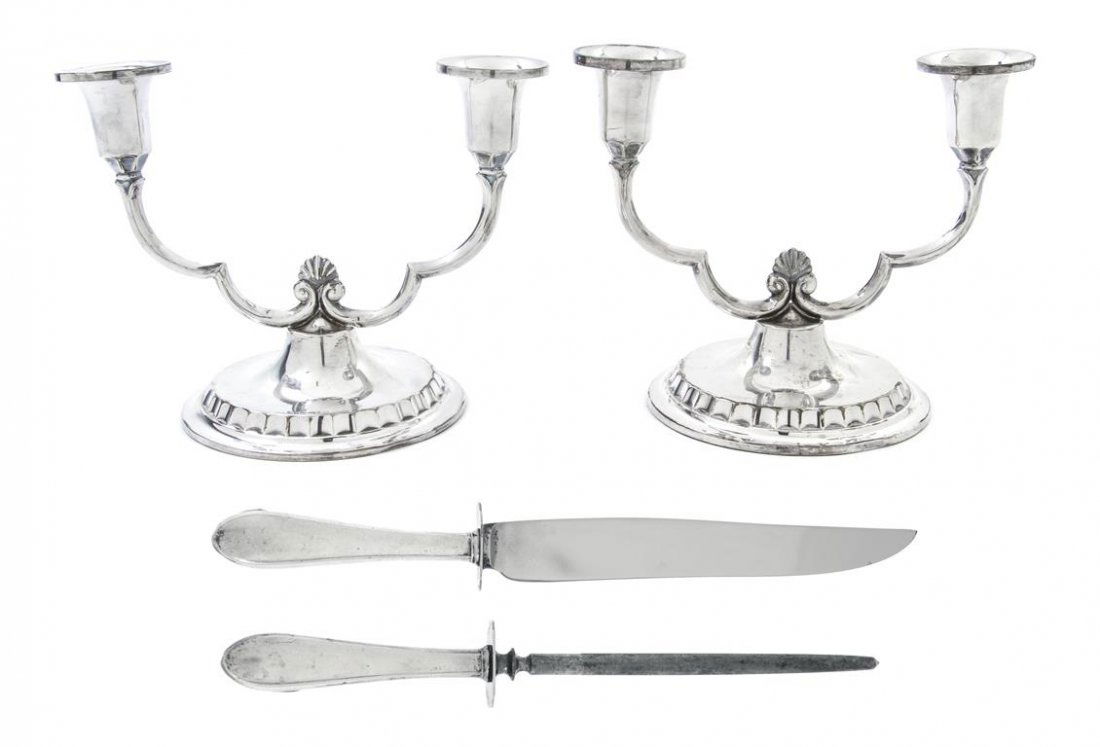 A Collection of Swedish Silver Articles, Length of long: A Collection of Swedish Silver Articles, comprising a carving knife, a knife sharpener and a pair of two-light candelabra with shell form finials raised on a circular foot, weighted. Length of longest