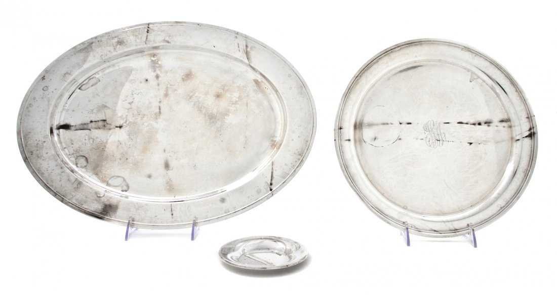 Three American Sterling Silver Articles, Width of wides: Three American Sterling Silver Articles, comprising a Gorham oval tray, an Alvin round tray and a Wallace dish; approximate total weight 53.04 ozt. Width of widest tray 18 inches. Property from the Es