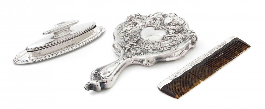 An Assembled American Sterling Silver Vanity Set, Lengt: An Assembled American Sterling Silver Vanity Set, comprising a hand mirror, a nail buff with undertray and a comb. Length of first 10 3/8 inches. Property from the Estate of Margaret Borden, Peoria, I