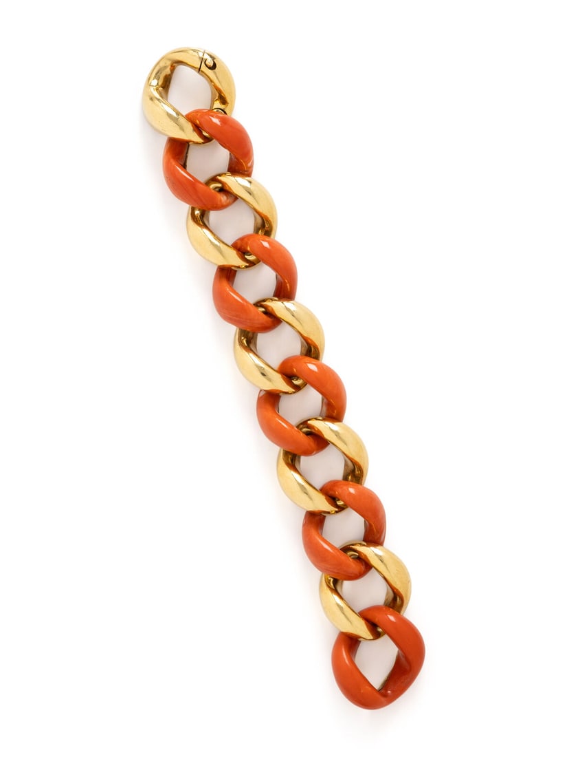 SEAMAN SCHEPPS, VINTAGE, 'CLASSIC LINK' YELLOW GOLD AND CORAL BRACELET: SEAMAN SCHEPPS, VINTAGE, 'CLASSIC LINK' YELLOW GOLD AND CORAL BRACELET Carved coral links backed in yellow gold and alternating with yellow gold links. 18 karat yellow gold. 7 1/2 inches long, 1 inch