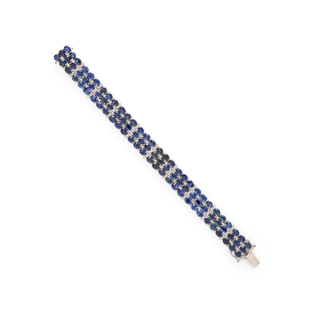 SAPPHIRE, DIAMOND, COLORED DIAMOND, AND WHITE GOLD BRACELET: SAPPHIRE, DIAMOND, COLORED DIAMOND, AND WHITE GOLD BRACELET Oval cut sapphires, round diamonds weighing approximately 0.75 carat total, and round yellow diamonds (origin of color not tested). 14 karat