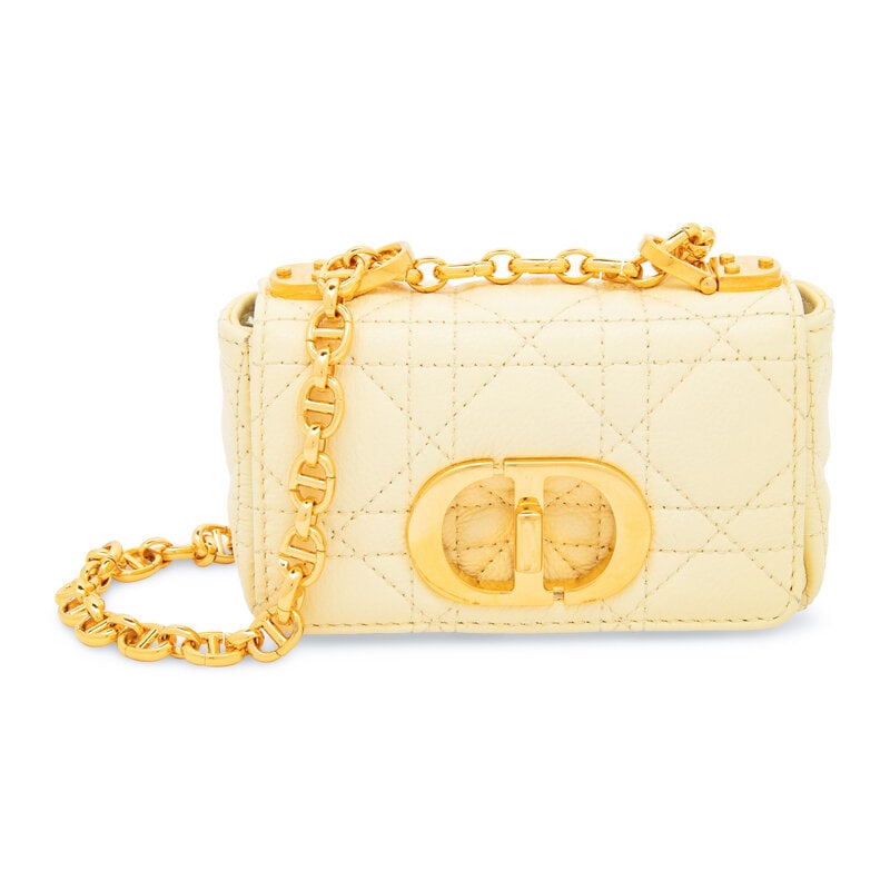 CHRISTIAN DIOR, MINI DIORADDICT FLAP BAG: CHRISTIAN DIOR, MINI DIORADDICT FLAP BAG Mini DiorAddict flap bag in butter yellow cannage-quilted leather with gold-tone hardware. Turn-lock closure and adjustable metal chain & leather strap. La