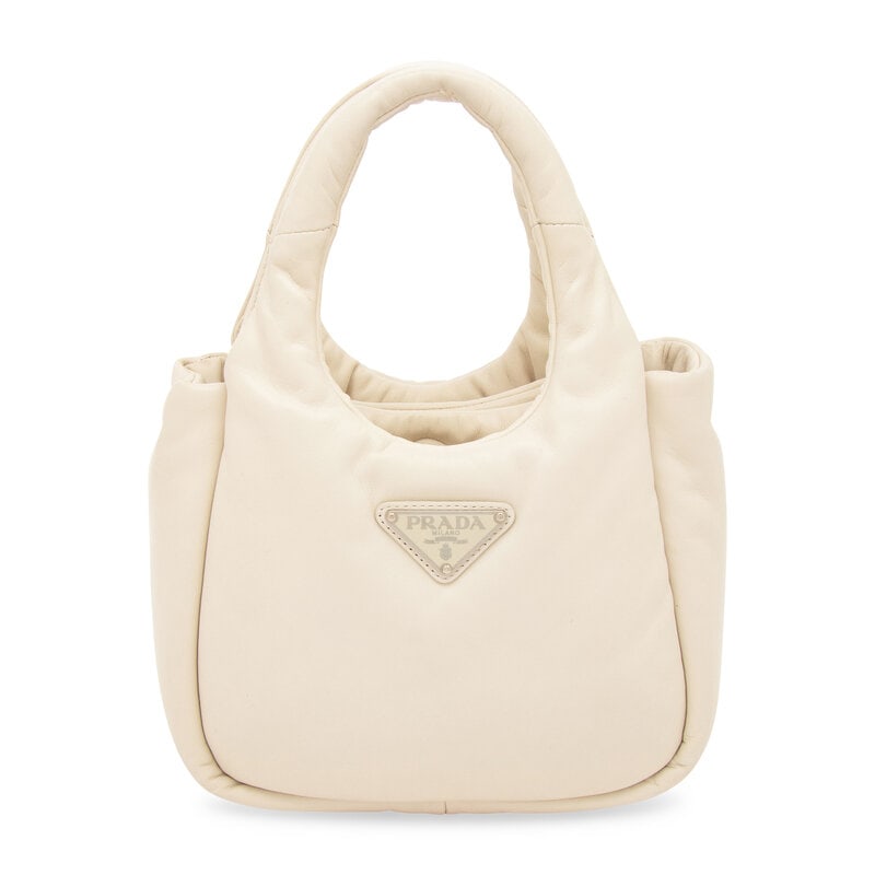 PRADA, SMALL PADDED LEATHER TOTE: PRADA, SMALL PADDED LEATHER TOTE Small tote bag in padded off-white nappa leather. Magnetic snap closure; padded leather handles and removable & adjustable leather shoulder strap. Label: Prada