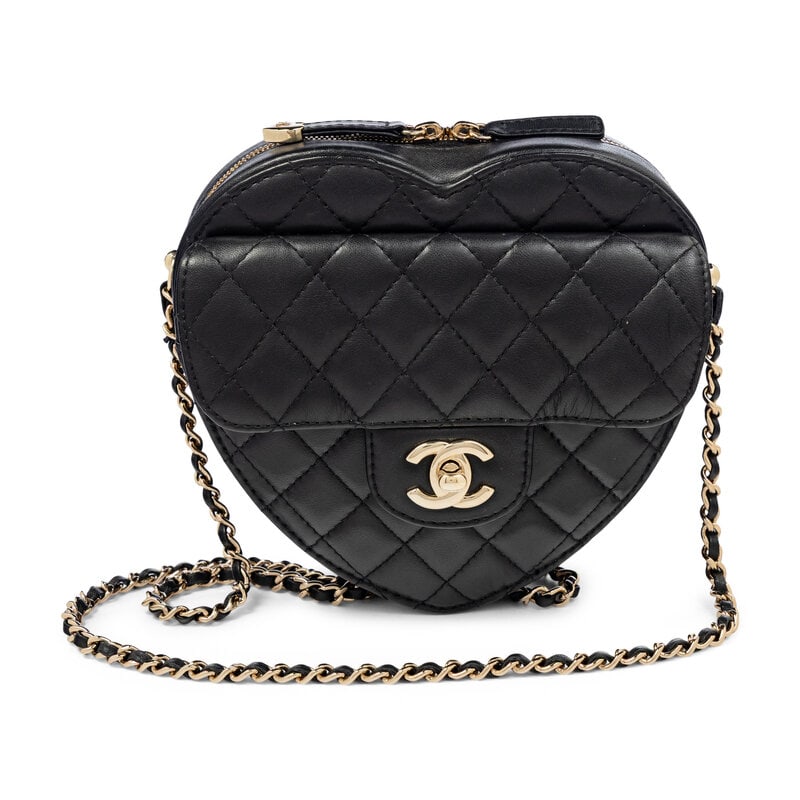 CHANEL, QUILTED LOVE HEART BAG: CHANEL, QUILTED LOVE HEART BAG Love Heart shoulder bag in quilted black lambskin leather with gold-tone hardware. Double zipper closure and interwoven leather-metal chain strap. Exterior slip