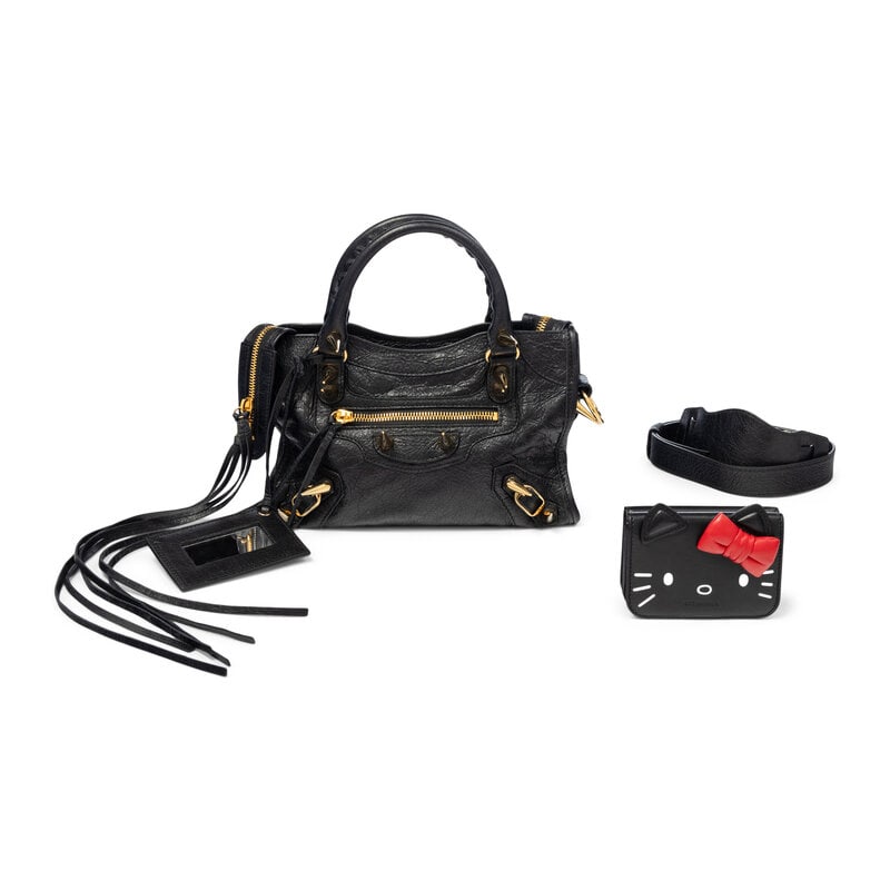 BALENCIAGA, SPIKE STUD MINI CITY BAG & HELLO KITTY WALLET: BALENCIAGA, SPIKE STUD MINI CITY BAG & HELLO KITTY WALLET THE FIRST Mini City Bag in black aged lambskin leather with large gold-tone metal spike stud embellishments. Double zipper closure,