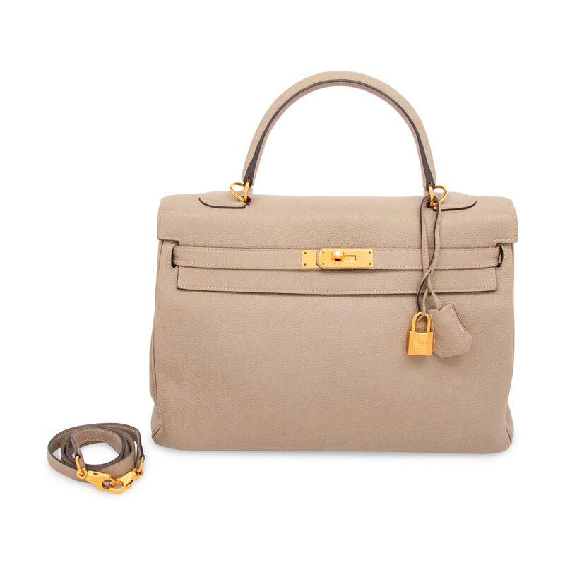 HERMÈS, KELLY 35 IN GRIS TOURTERELLE TOGO: HERMÈS, KELLY 35 IN GRIS TOURTERELLE TOGO Kelly 35 Retourne in Gris Tourterelle Togo leather with gold-plated hardware. With removable shoulder strap. Label: Hermès Code: T, no square Date: