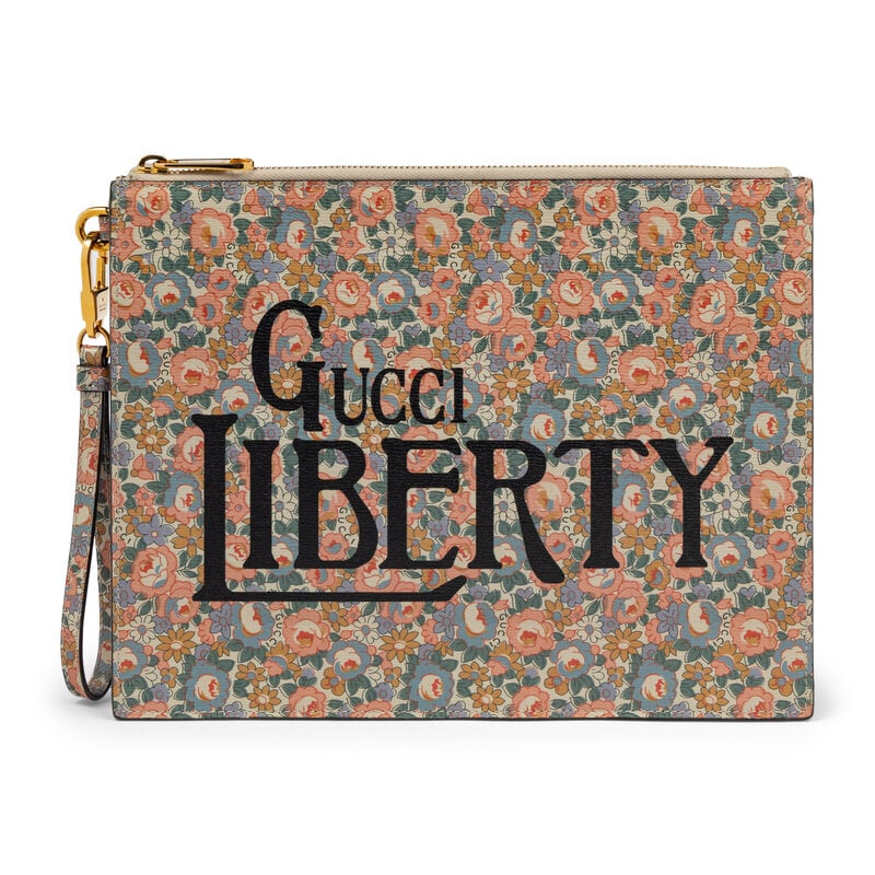 GUCCI x LIBERTY, FLORAL-PRINT LEATHER CLUTCH: GUCCI x LIBERTY, FLORAL-PRINT LEATHER CLUTCH Clutch/wristlet in multicolor 'Poppy and Daisy' flora-print leather with "GUCCI LIBERTY" logo print. Zipper closure and removable leather wristlet strap. L