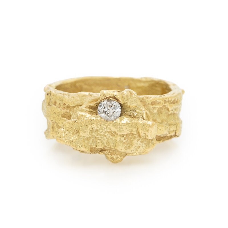 E. DUCA, HAMMERED YELLOW GOLD AND DIAMOND RING: E. DUCA, HAMMERED YELLOW GOLD AND DIAMOND RING Round diamond. 18 karat yellow gold. Ring size 7. Stamp: 18K E. DUCA. Gross weight: 7.55 dwt. ConditionOverall Condition: Light wear to gold.Diamond