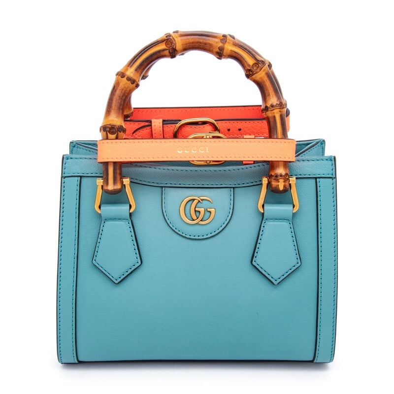 GUCCI, SMALL BLUE DIANA BAG: GUCCI, SMALL BLUE DIANA BAG Small Diana bag in eggshell blue grained leather. Magnetic snap closure at interior, bamboo handles, and removable leather shoulder strap. Label: Gucci Style/Serial