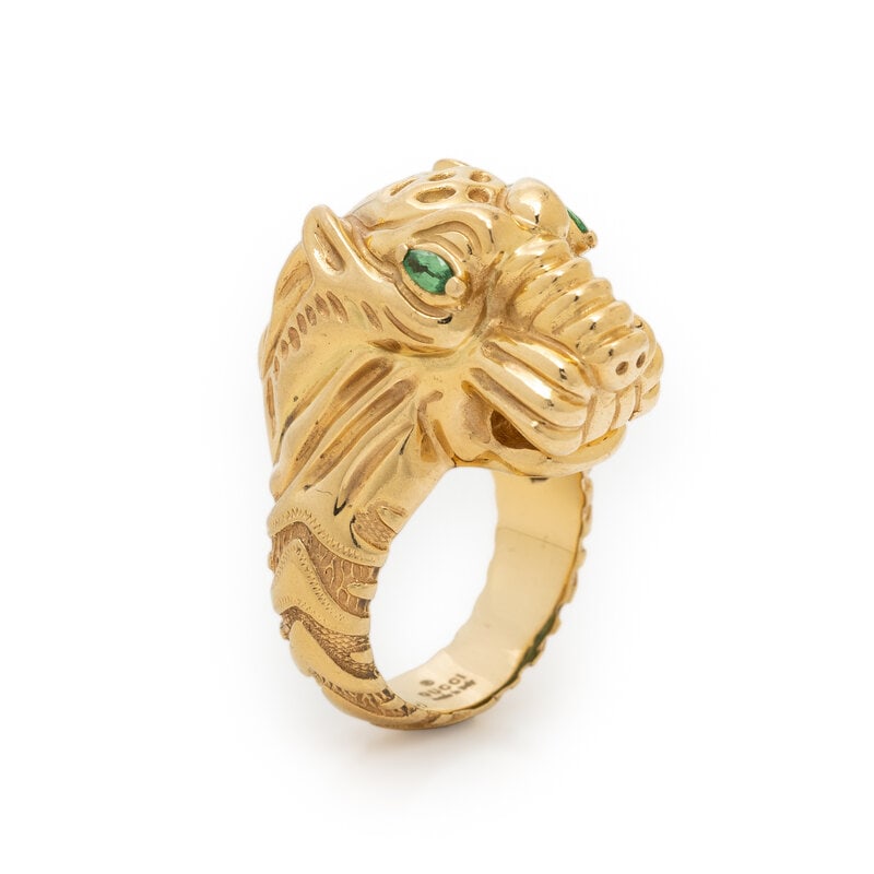 GUCCI, YELLOW GOLD TIGER RING : GUCCI, YELLOW GOLD TIGER RING Marquise cut green crystals and green enamel. 18 karat yellow gold. Ring size 6 1/4. Stamp: GUCCI MADE IN ITALY 13 Au 750 (Italian maker's mark). Gross weight: 13.10