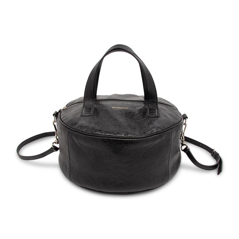 BALENCIAGA, AGED LEATHER CIRCLE BAG: BALENCIAGA, AGED LEATHER CIRCLE BAG Circle bag in aged black leather. Zipper closure, flat leather handles, and removable flat leather shoulder strap. Label: Balenciaga Style/Serial No.: