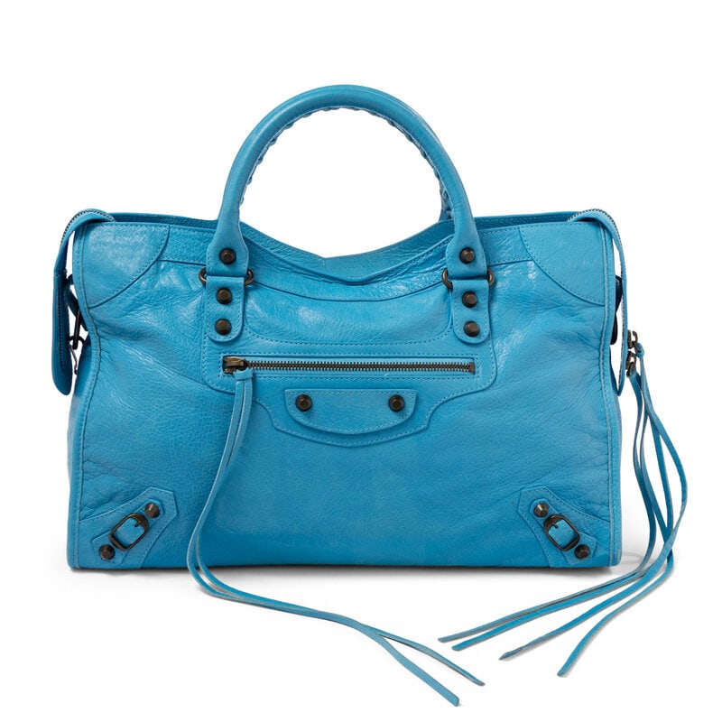 BALENCIAGA, SKY BLUE MEDIUM CITY BAG: BALENCIAGA, SKY BLUE MEDIUM CITY BAG Medium City bag in sky blue aged lambskin leather. Zipper closure, rolled handles with cord whipstitching, and removable flat leather shoulder strap. Label: