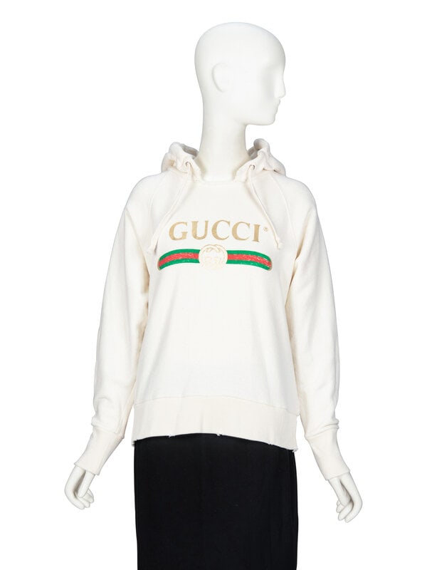 GUCCI, EMBROIDERED-BACK LOGO HOODIE: GUCCI, EMBROIDERED-BACK LOGO HOODIE As seen in runway look #34 in of the Resort 2017 collection by Alessandro Michele for Gucci. Lightly distressed hoodie in cream cotton French terry. Features Gucci