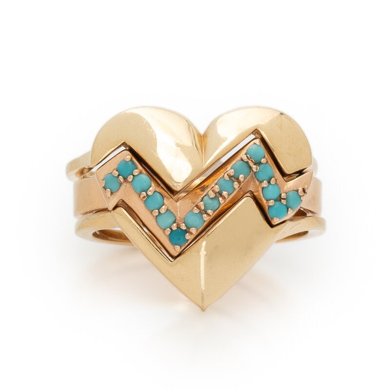 COLLECTION OF THREE YELLOW GOLD STACKING RINGS: COLLECTION OF THREE YELLOW GOLD STACKING RINGS Including three stacking rings, one set with round cabochon blue stones. 14 karat yellow gold and rose gold. Ring size 6 1/4. Stamp: 14K (maker's