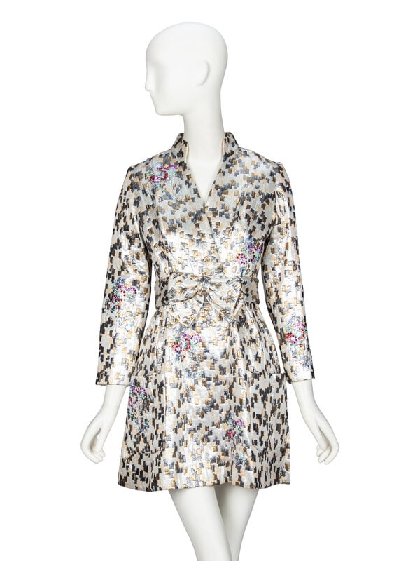 LIBERTINE, EMBELLISHED BROCADE MINIDRESS: LIBERTINE, EMBELLISHED BROCADE MINIDRESS Minidress in a multicolor metallic brocade with multicolor rhinestone embellishments throughout. V neckline with stand collar. Wrist-length set-in sleeves. Fau