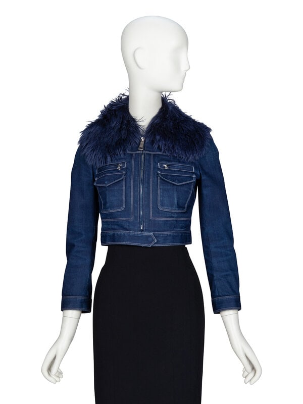 PRADA, FUR & DENIM CROP JACKET: PRADA, FUR & DENIM CROP JACKET Cropped fitted jacket in indigo-dyed cotton denim with a removable oversized indigo-dyed alpaca fur collar. Spread collar. Wrist-length sleeves with zipper