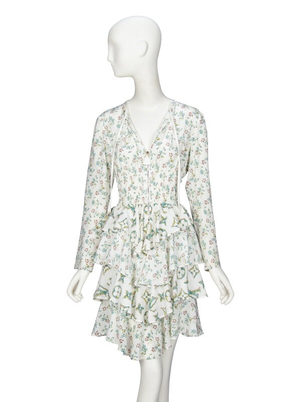 LOUIS VUITTON, FLORAL SILK RUFFLE DRESS: LOUIS VUITTON, FLORAL SILK RUFFLE DRESS Knee-length dress in floral and monogram print white stretch-blend silk crêpe de chine. Keyhole neckline with extended ties at front of neck.