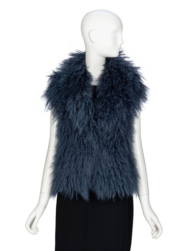 GUCCI, BLUE MONGOLIAN LAMB VEST: GUCCI, BLUE MONGOLIAN LAMB VEST Vest in blue Mongolian lamb fur; back panel in black wool-blend ribbed knit. Wide spread collar & notched lapels. Two welt pockets at front. Two hook-and-eye closur