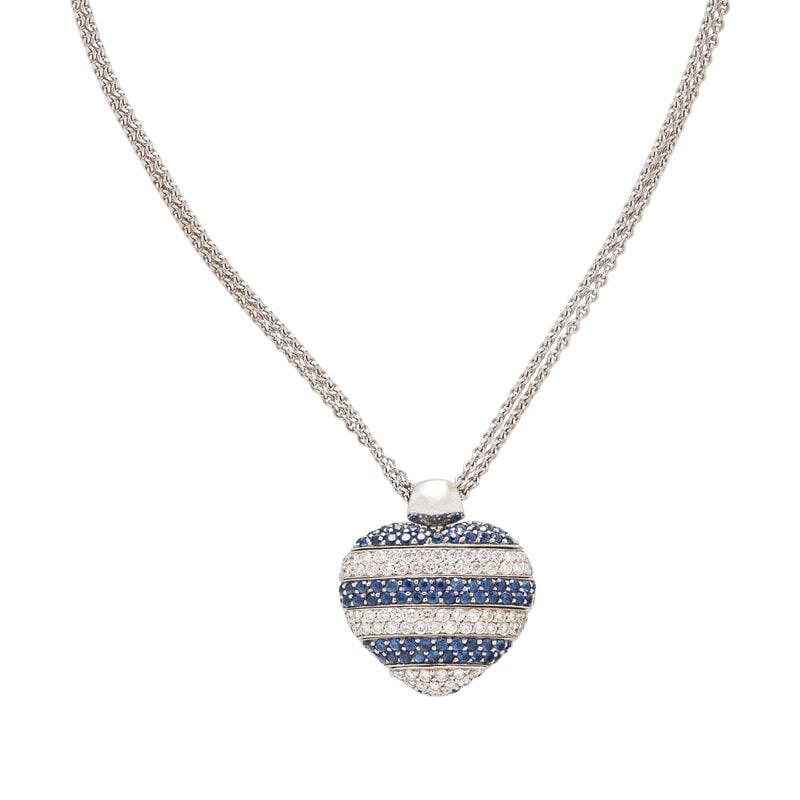 CRIVELLI, SAPPHIRE AND DIAMOND ADJUSTABLE HEART PENDANT: CRIVELLI, SAPPHIRE AND DIAMOND ADJUSTABLE HEART PENDANT The heart pendant set with articulated rows of round sapphires and round diamonds weighing approximately 1.00 - 1.30 carats total. 18 karat whit