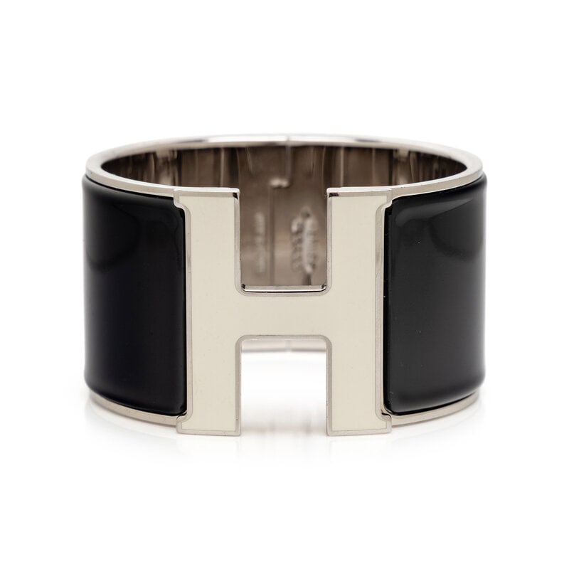 HERMÈS, CLIC CLAC H ENAMEL BRACELET: HERMÈS, CLIC CLAC H ENAMEL BRACELET Clic Clac H cuff bracelet in palladium-plated metal with black & white enamel inlays. Turn-lock clasp closure. Stamped "Hermès / Paris / Made in