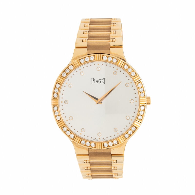 PIAGET, 'DANCER' 18K YELLOW GOLD WATCH WITH DIAMOND BEZEL AND INDICES: PIAGET, 'DANCER' 18K YELLOW GOLD WATCH WITH DIAMOND BEZEL AND INDICES Maker: Piaget Model: Dancer Reference number: PI0444 Serial number: 1017070 Case size: Approx. 38 mm Case material: 18K yellow