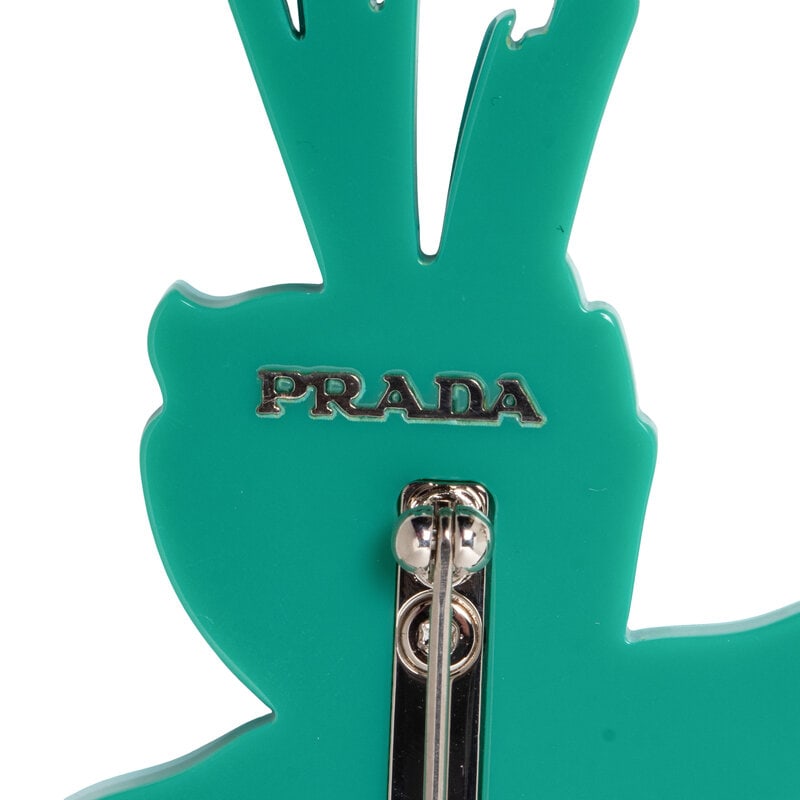 PRADA & MIU MIU, THREE BROOCHES & TWO PAIRS OF EAR CLIPS - 4