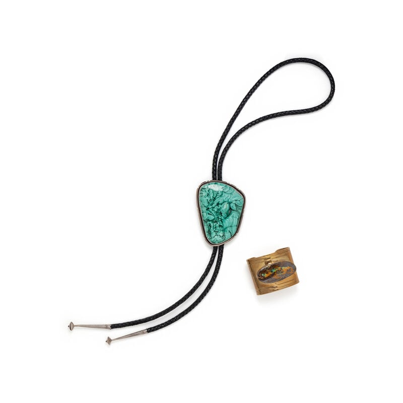 JODY CANDRIAN, CUFF BRACELET & BOLO TIE: JODY CANDRIAN, CUFF BRACELET & BOLO TIE THE FIRST Open cuff bracelet in gold-tone metal with inset boulder opal. Stamped "JODY CANDRIAN" at interior. Label: Jody Candrian Country of Origin: