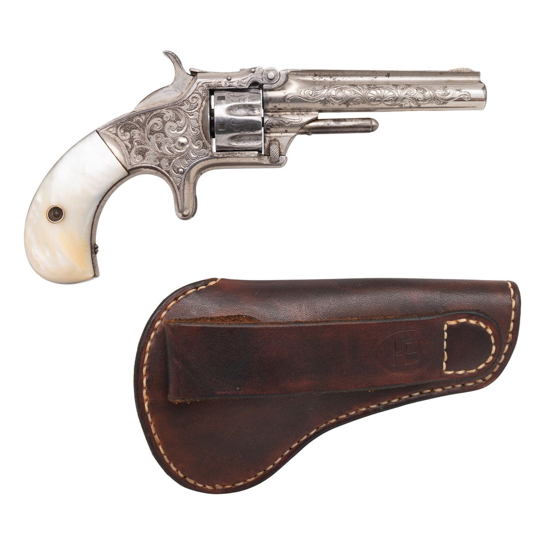 Engraved Smith & Wesson Model No. 1 3rd Issue Revolver with Mother of Pearl Grips: Engraved Smith & Wesson Model No. 1 3rd Issue Revolver with Mother of Pearl Grips .22RF Short. 3.125" ribbed round barrel. SN: 137949 (mfg. ca. 1870). Nickel finish, mother of pear grips. Single a